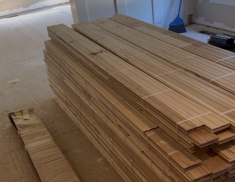 Stacked hardwood acclimating inside a home before installation