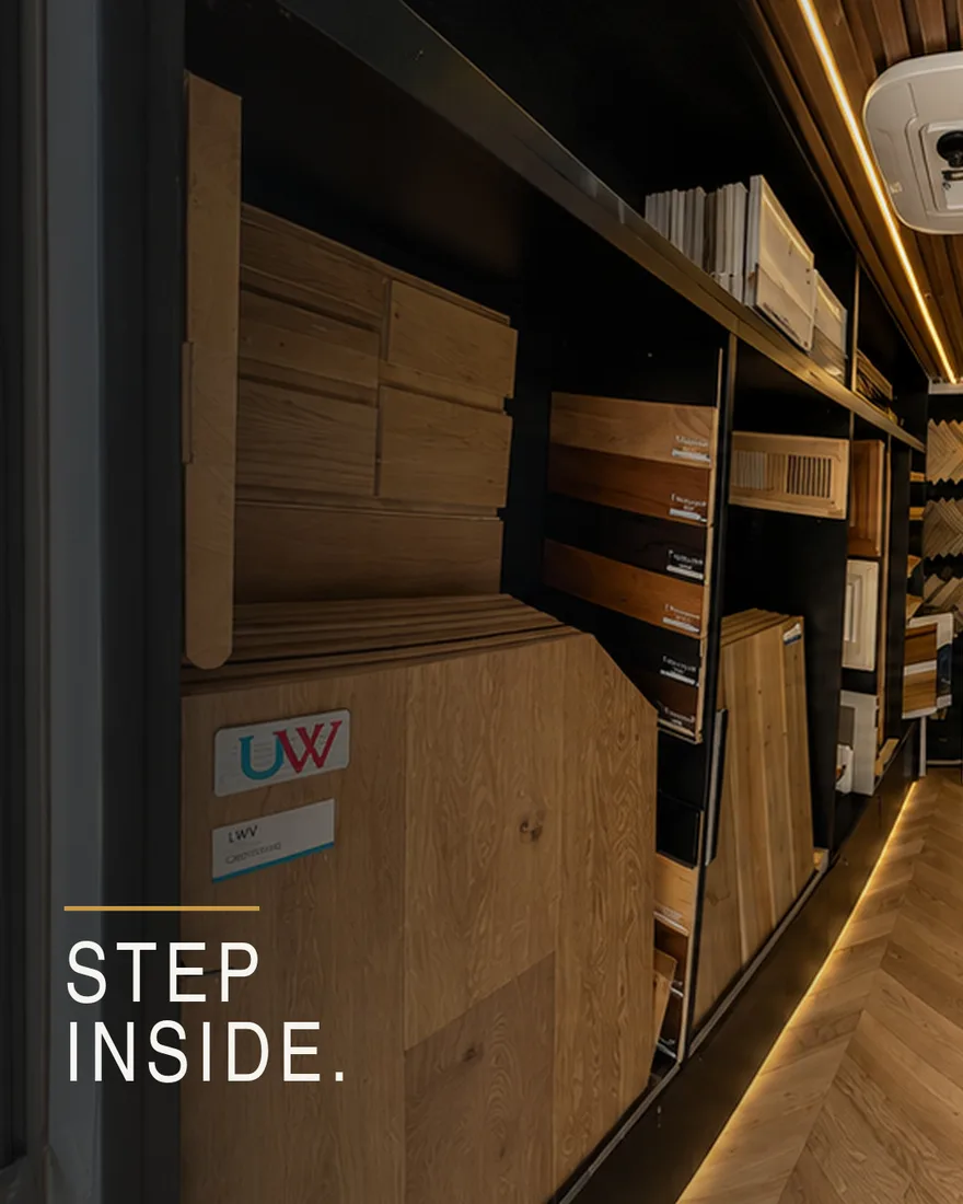 Inside the HD Hardwood Floors mobile flooring studio: wall of hardwood samples