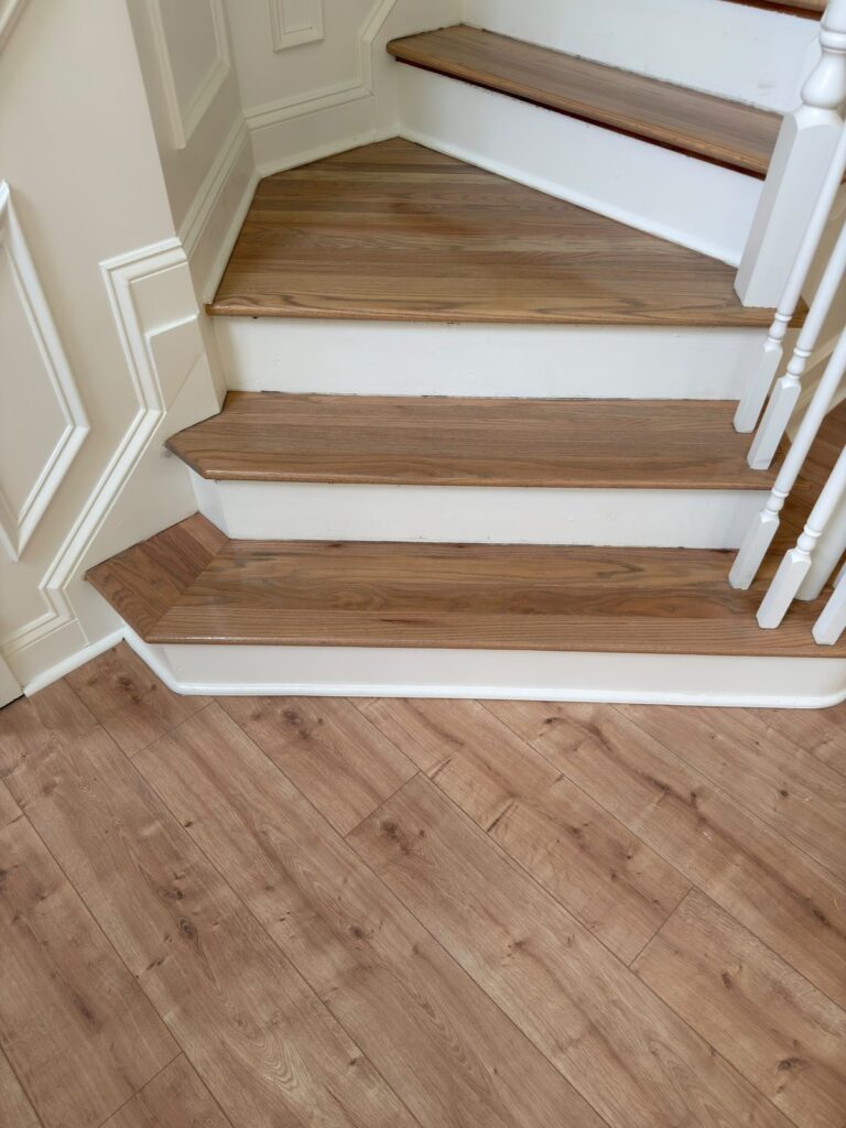 Oak stair treads in a natural finish with white risers